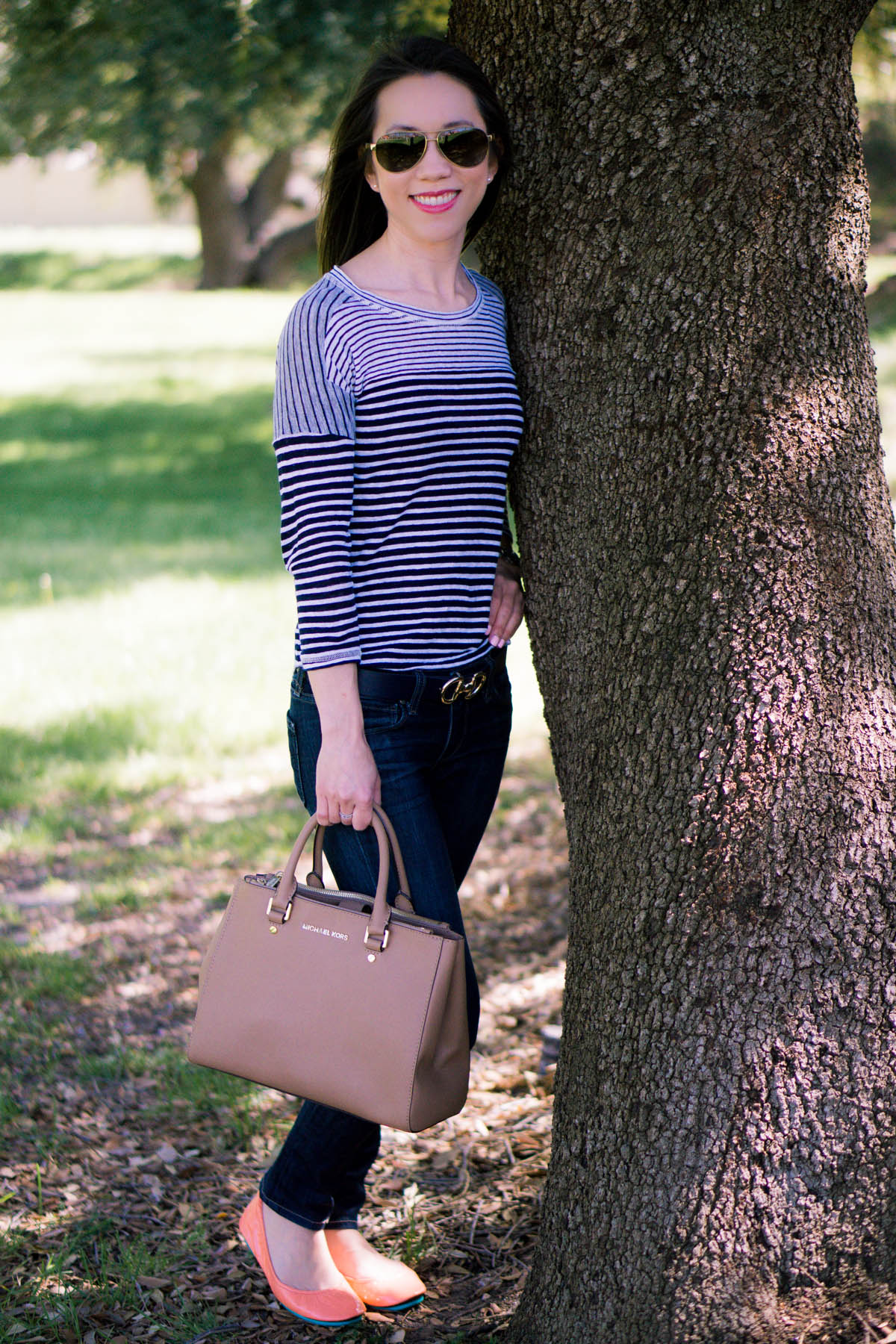 Petite fashion | Petite Style | Easy casual outfit inspiration | Tieks coral patent ballet flats. J. Crew striped tee. Paige denim. Michael Kors Sutton handbag