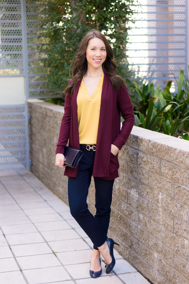 How to Wear Navy & Mustard Yellow together | Work outfit inspiration | Lush tunic blouse | Ann Taylor yellow ruffle blouse | Petite fashion and style blog | Banana Republic Sloan Pants | Gibson burgundy cardigan | Talbots reversible belt | Tory Burch wallet clutch | Office style | yellow and navy
