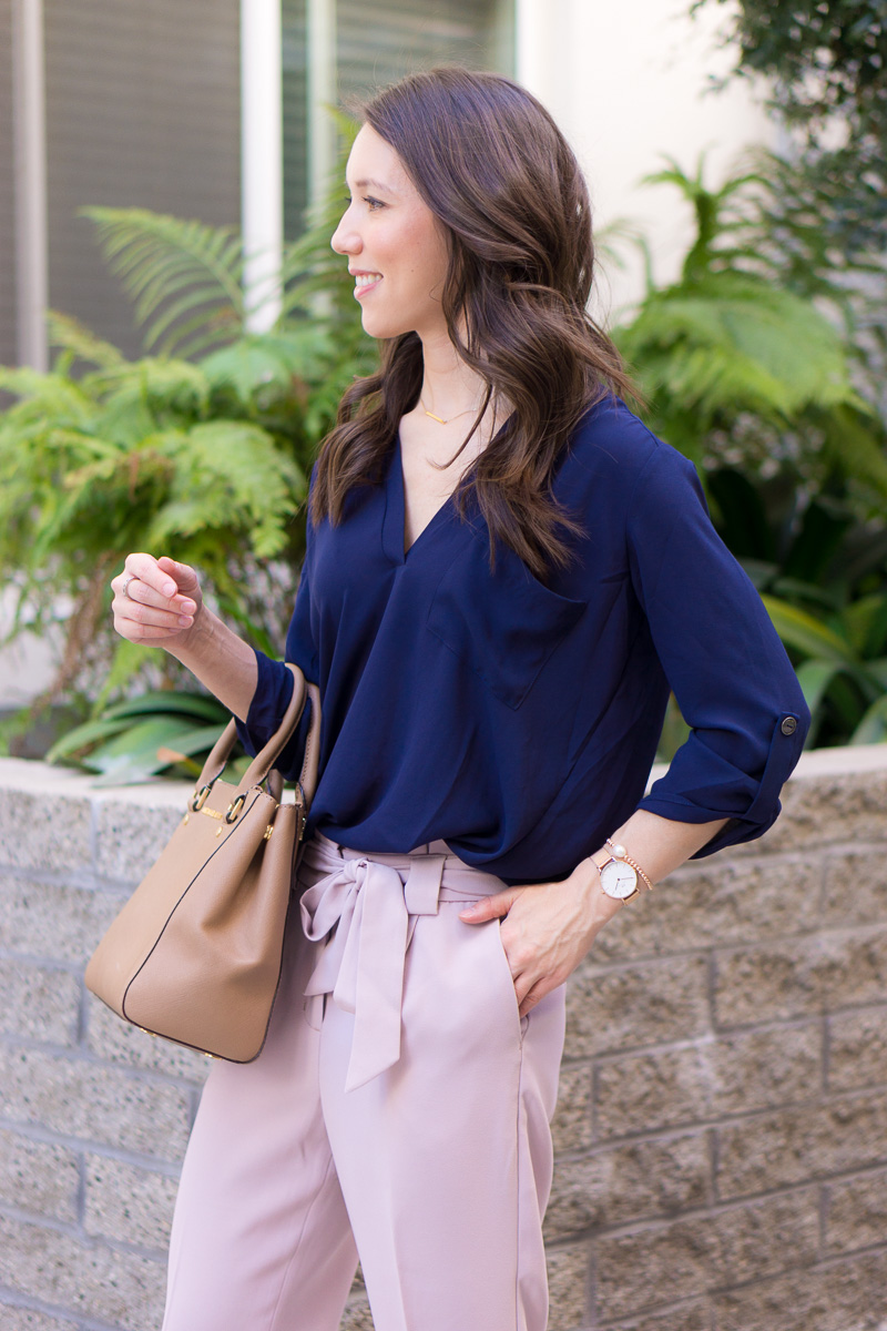 Two work outfits for early spring | Lavender pants | Blush pink high-waisted pants | Floral embroidered columnist black pants | Express petite fashion review | Petite style blog | Lush tunic blouse navy pink | Ann Taylor block sandals | Ivory heels | Springtime Summer outfit inspiration | rose gold bracelets accessories