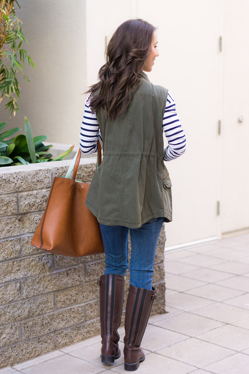 How to style a utility vest | women utility vest | Caslon olive green vest | navy vest | spring layers | summer layers | olive green striped tee brown tote bag | paige white denim navy olive green vest | FIGS longsleeve underscrub tee | FIGS scrubs review | M. Gemi Cerchio sneaker review | gray slip on sneakers | Aquatalia brown riding boots | waterproof boots review | petite fashion and style blog | capsule wardrobe advice